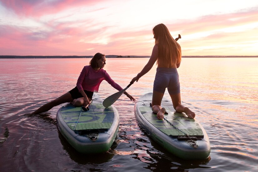 Full Shot Women Paddleboarding Sunset 23 2149643075